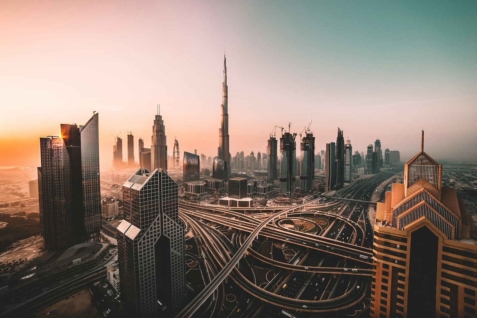 Dubai skyline and highway interchange at sunset