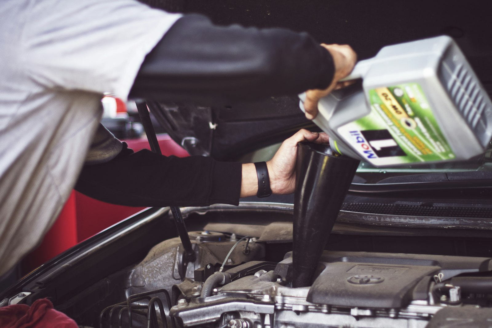 Mechanic servicing a car engine